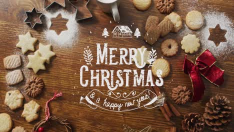 Animation-of-merry-christmas-over-cookies-and-decorations-on-wooden-surface