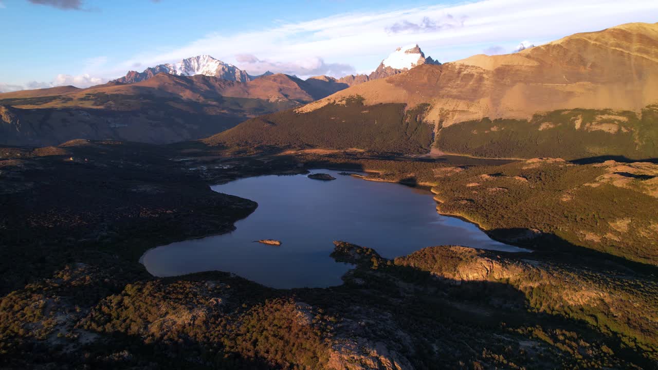 Stunning Aerial View of a Lake in Patagonia, Surrounded by Majestic Andes Mountains at Sunset