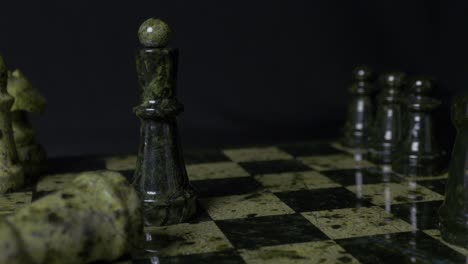 chess game with green stone pieces