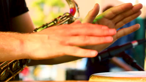 musician playing the bongo drums in slo-mo