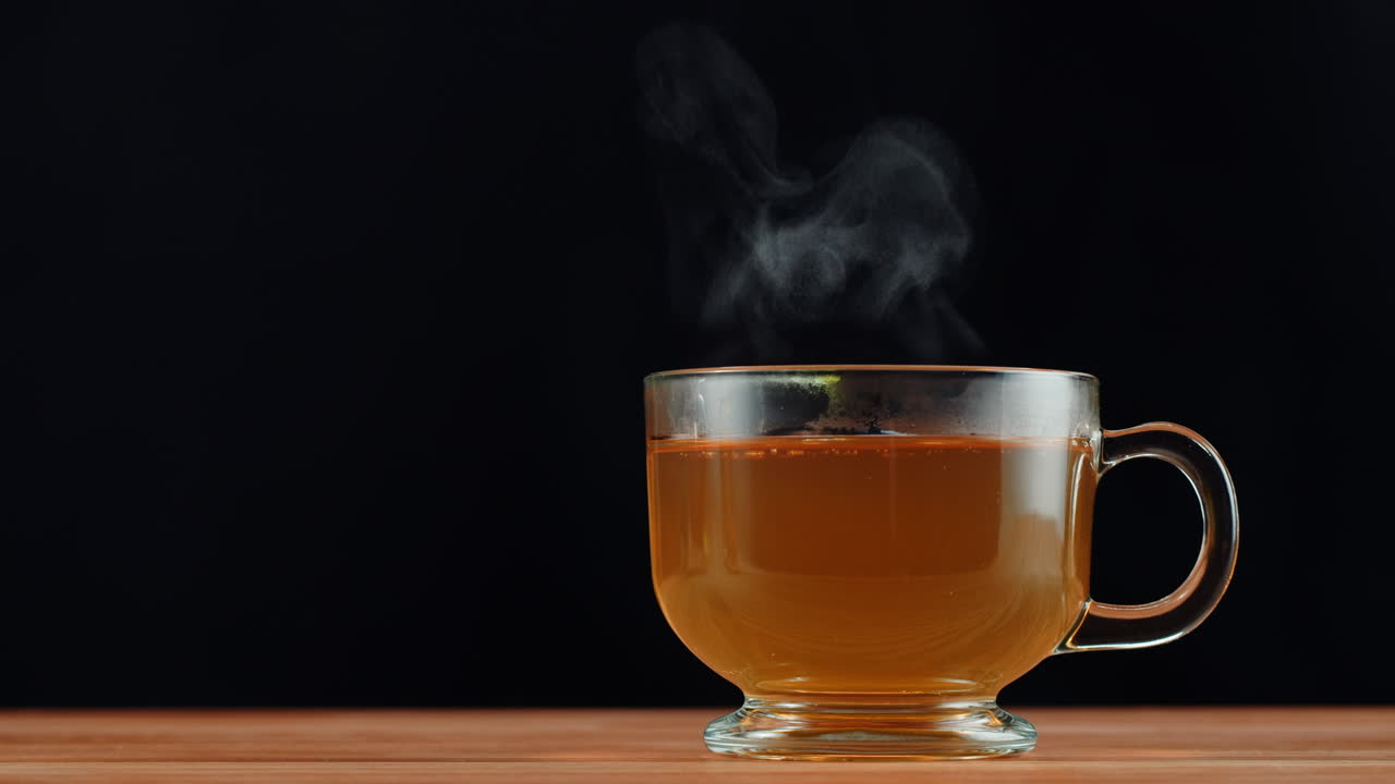 Steaming Hot Tea in a Clear Glass Cup