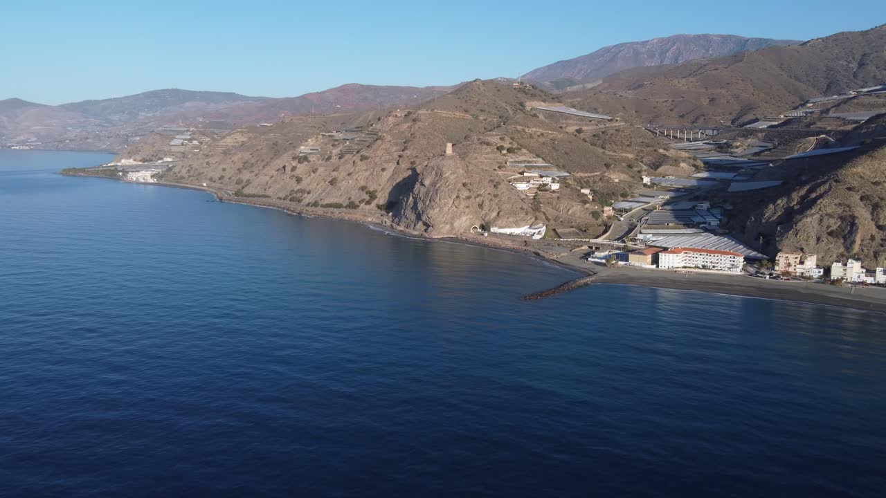 Aerial View of Coastal Landscape with Mountains and Beach