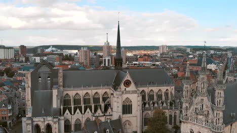 fly-over pan across leuven saint peter's church to town hall, belgium