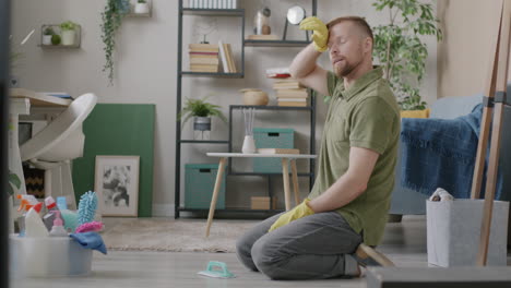 man cleaning his home