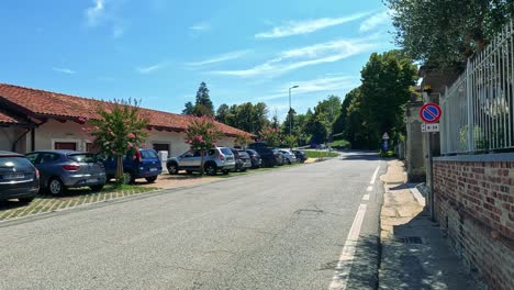 vehicles moving along a sunny italian street