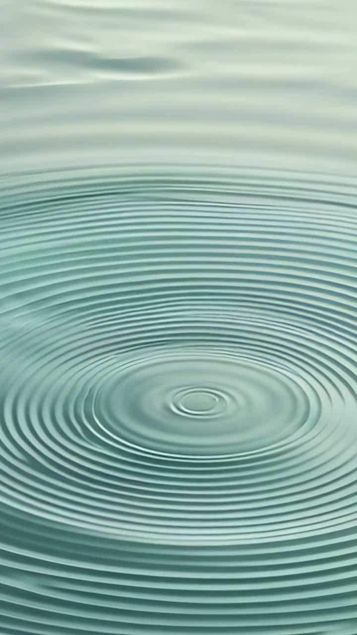 Vertical video: Causing ripples racing across pond surface by droplet impact, revealing wave motion