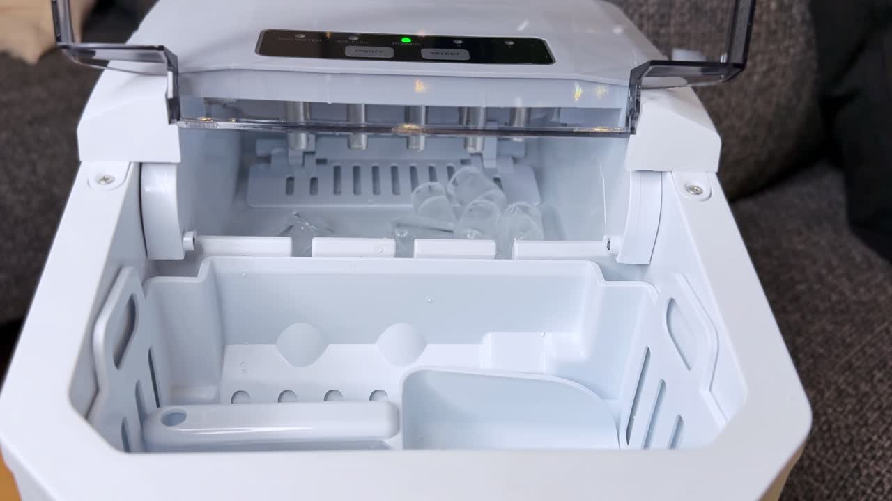 Macro view of ice cubes forming on bullet mold heads inside a modern ice maker. Clean, well-lit interior shot perfect for appliance demos, B-roll, and home tech explainer content