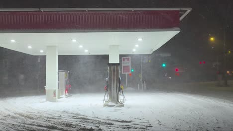 snowy gas station at night in orford, québec, with heavy snowfall and cold atmosphere