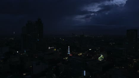 Aerial-View-Of-Lit-Christmas-Tree-With-Glowing-Lights-At-The-Fuente-Osmeña-Circle-In-Cebu,-Philippines