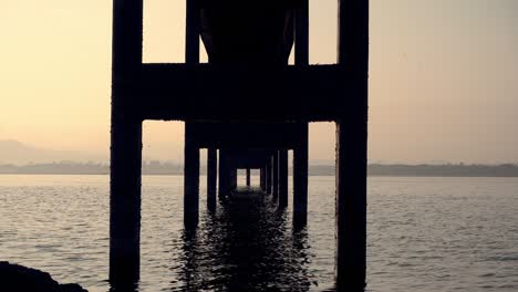 landscape view of bang phra reservoir with old pumping station at sunrise.