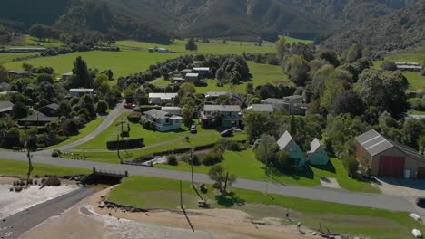 aerial shot of anakiwa town by beach, queen charlotte sound, marlborough sounds, south island, new zeland