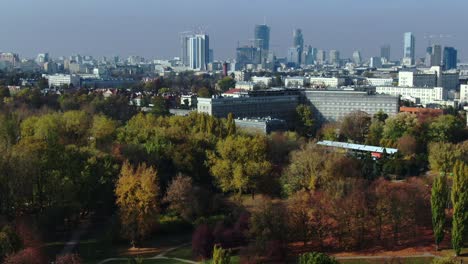 Urban-green-place-unveiling-Warsaw-city-skyline-with-gigantic-stock-buildings,-nature-meets-modern-lifestyle