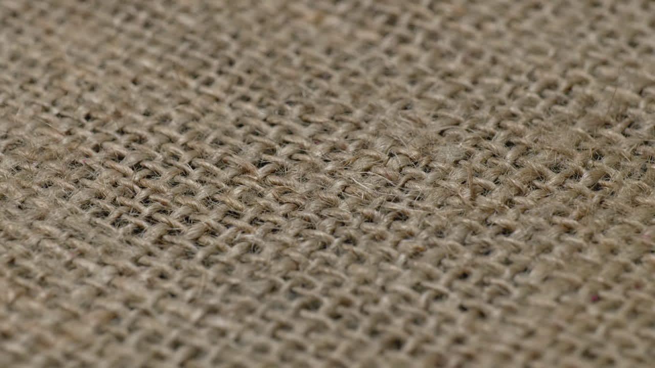 textured Jute Gunny Cloth or Hessian Cloth close up, parallax shot 4k