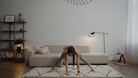 woman doing a leg stretch at home