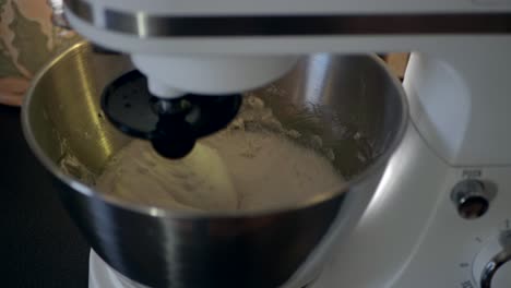 Mixing-the-gluten-free-dough-with-the-help-of-a-kitchen-assistent