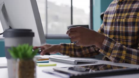 mixed race man using phone at the office