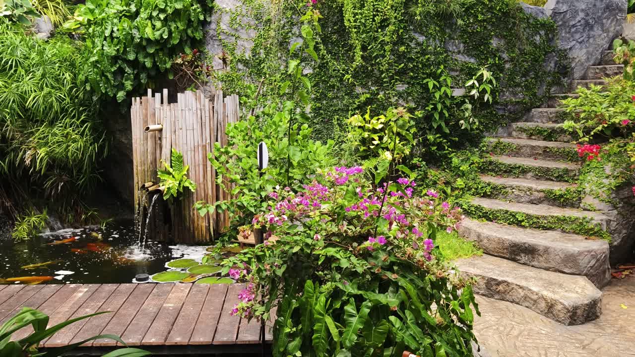 Tropical Garden with Water Feature and Stone Steps