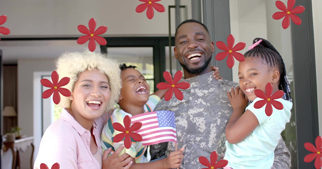 Família posando na porta marcando boas-vindas militares enquanto menino acena bandeira, flores vermelhas passando sobre os rostos.
