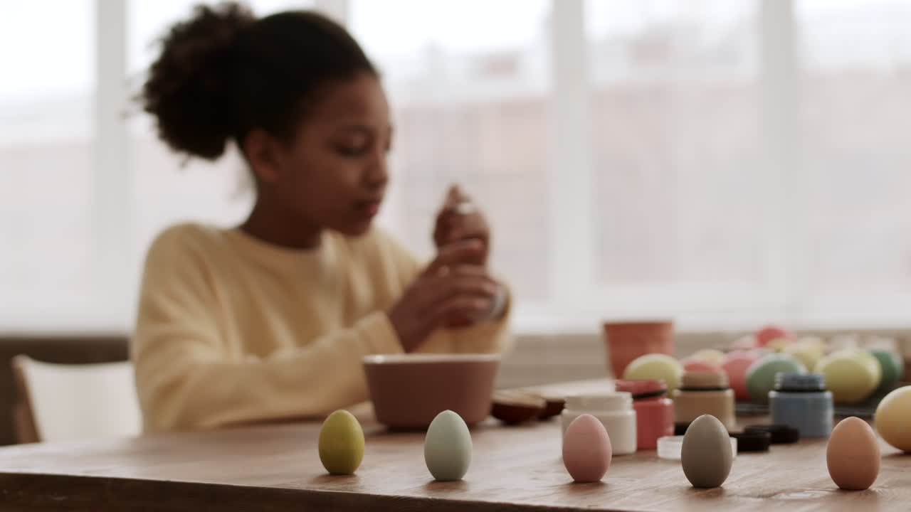 Lots of Colored Eggs and Person