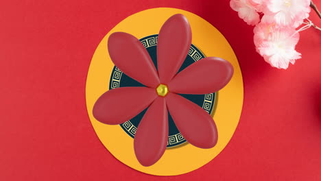 animation of chinese pattern and flowers with copy space on red background