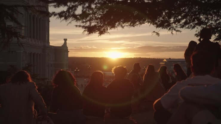 People watching sunset in the city