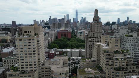 drone push-in shot of e 12th street, new york in horizontal orientation. captures the urban landscape and street activity, perfect for real estate, travel, or cityscape projects.