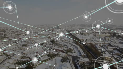 network of connections and data processing animation over snowy urban landscape