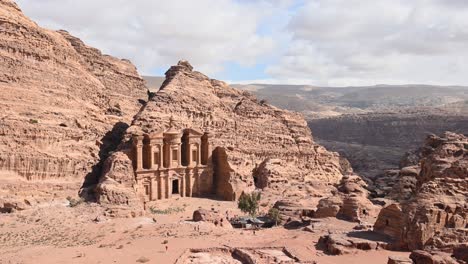 stunning view of ad-deir, a monumental building carved out of rock in the ancient jordanian city of petra.