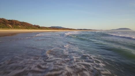 Fast-fly-over-above-shallow-waters-of-Pacific-Ocean-on-the-East-Coast-of-Australia