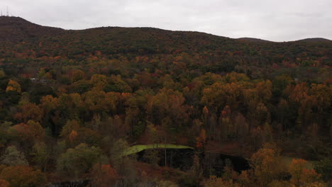 an aerial drone shot of the colorful fall foliage in upstate ny