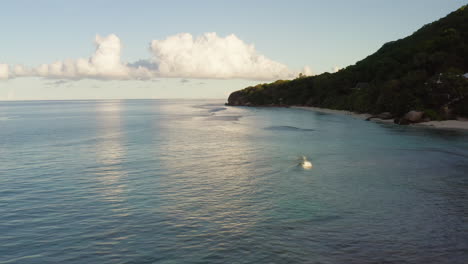 A-drone-flying-along-the-shore-above-the-ocean