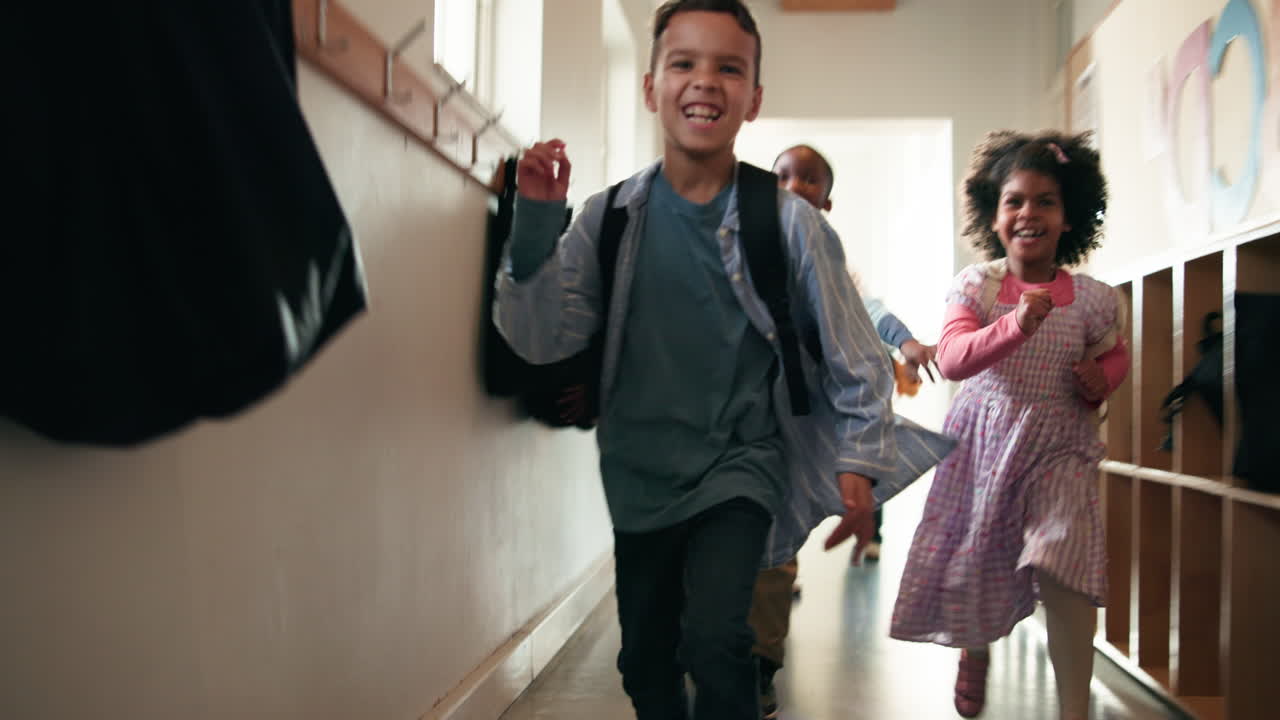Excited Students Running in School Hallway