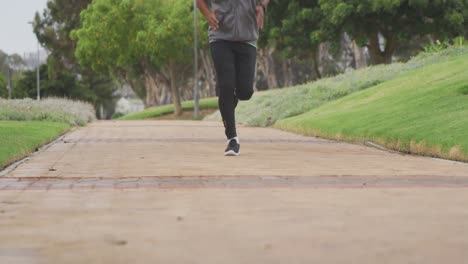 front view man with prosthetic leg running