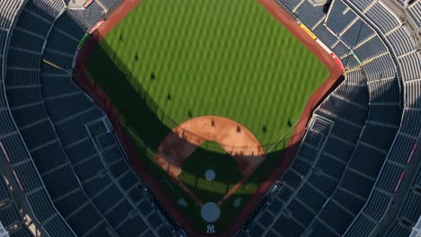 yankee stadium birds eye view of field. tilt up aerial shot from home plate to centerfield. new york yankees baseball theme.