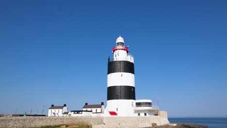 a 4k close up of hook head light house and light keepers cottages