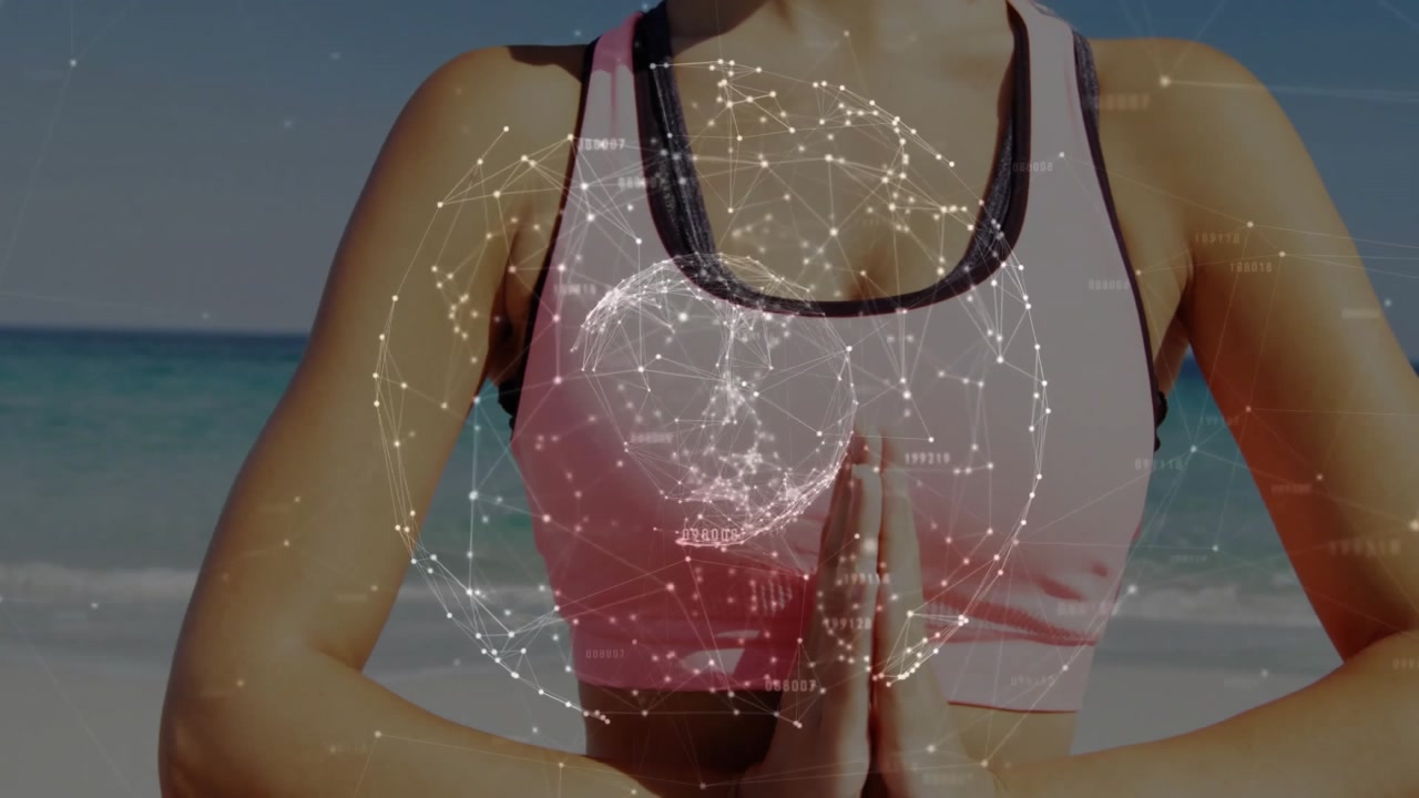 female yogi praying summoning glowing globe forming mudra on pink mat by ocean for wellness