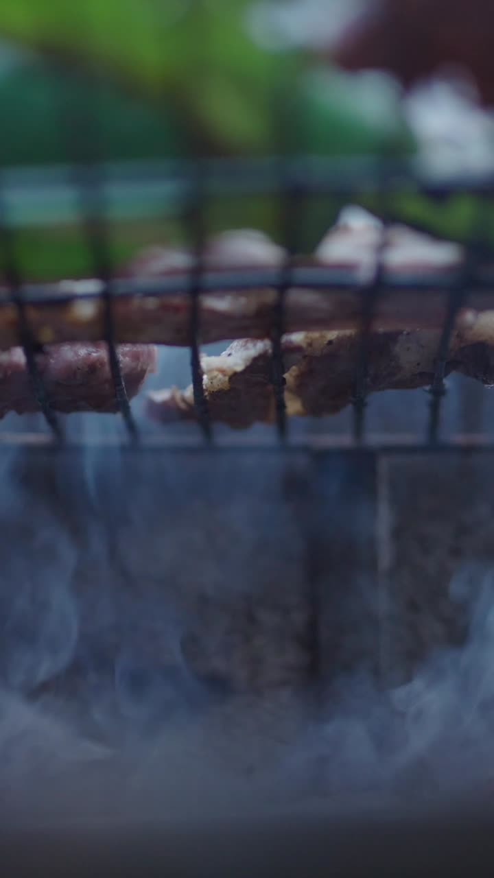Meat Grilling on Barbecue with Smoke