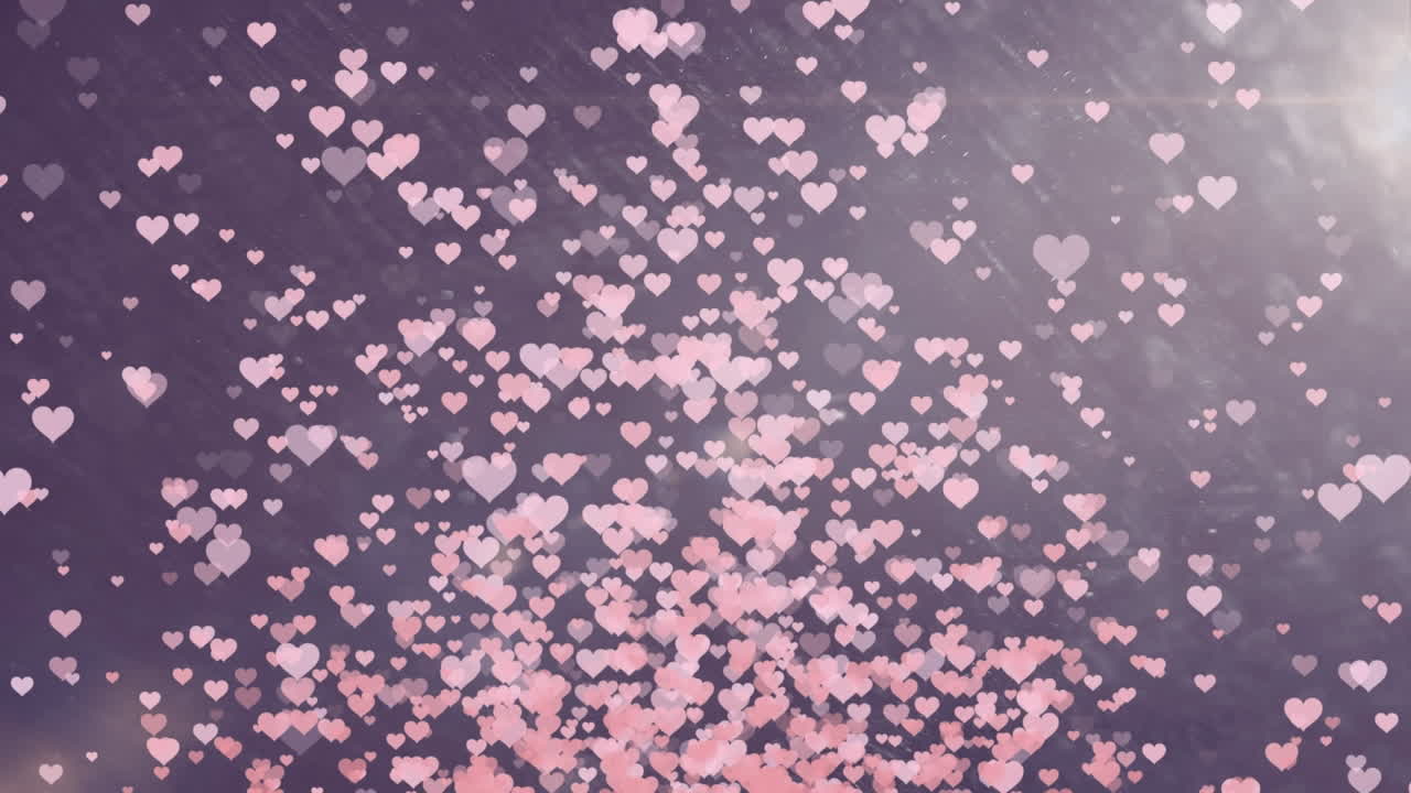 animación de puntos de luz y corazones sobre fondo azul