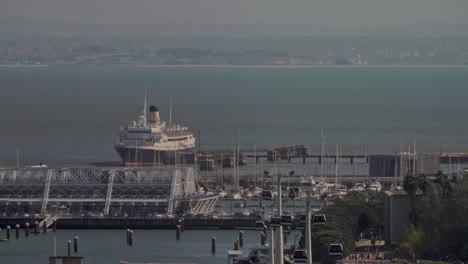 an aerial view of a ship near the lisbon port quay