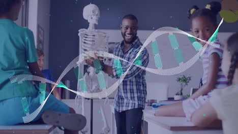 Animation-of-dna-strand-over-smiling-african-american-male-teacher-showing-pupils-skeleton-in-class