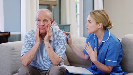 community nurse visits senior man suffering with depression