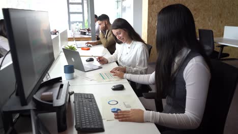 women reading documents in office