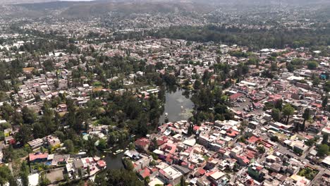 Aerial-Xochimilco:-a-look-at-canals,-boats-and-flowers