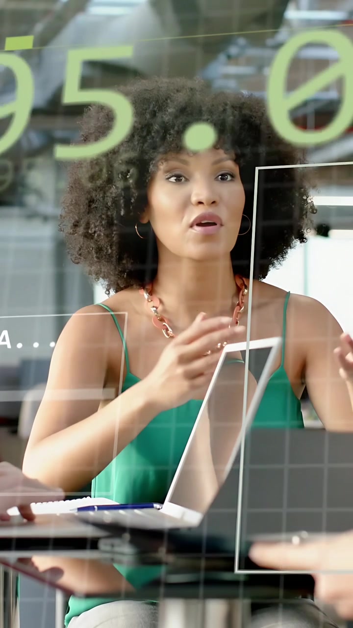 Vertical video: Woman leading business sync, reacting to cue, explaining data on green glass grid