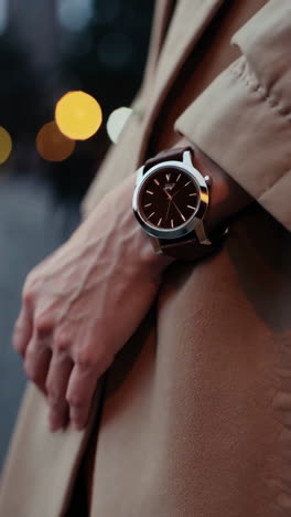 close-up of an elegant wristwatch with bokeh lights