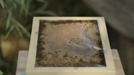 grungy square surface with film cover