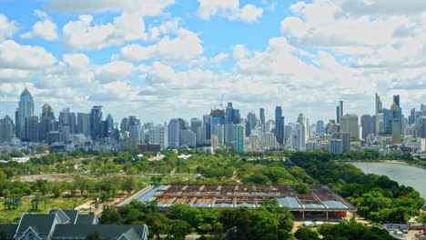 time lapse shot of panoramic view of bangkok's skyscrapers and the green area during a cloudy day