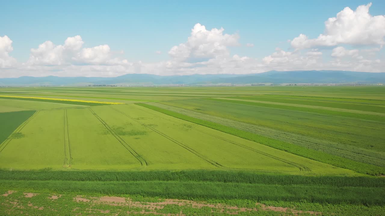 Aerial drone shot of plain fields near Brasov, Romania