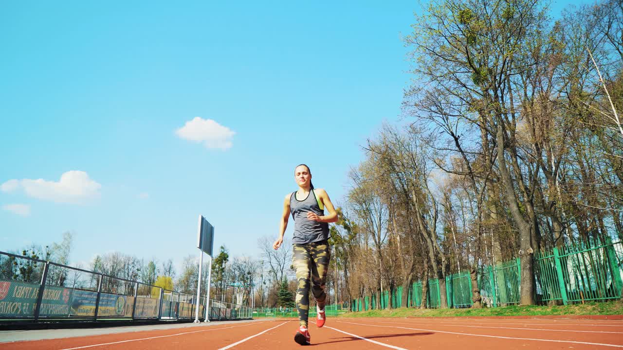 Sport reaction video Athletes at starting position preparing for run at the stadium. Healthy fitness lifestyle