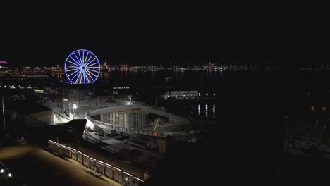 seattle great wheel and boat in puget sound